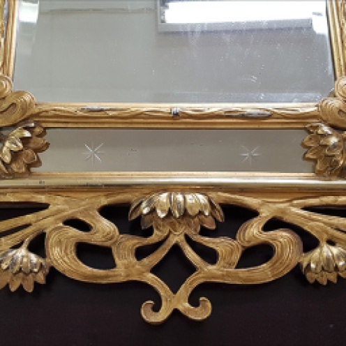 Bottom ornamental part of the frame after reconstruction and retouching.